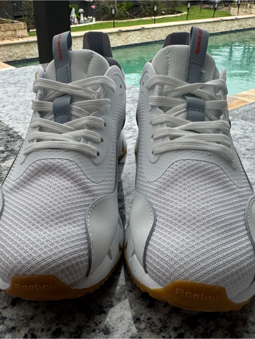 Reebok White and Gray Trail Runner with Orange Logo Accent